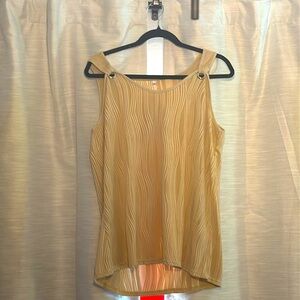 Cream Cami with wave like pattern embedded in fabric.